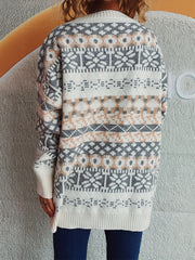 Fair Isle knit oversized sweater with crew neck and long sleeves in white, grey, and peach pattern.