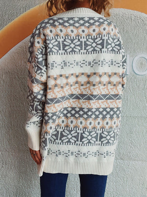 Fair Isle knit oversized sweater with crew neck and long sleeves in white, grey, and peach pattern.