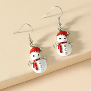 Festive snowman drop earrings with red hats, scarves, and crystal accents.