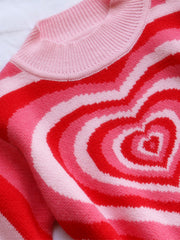 Pink and red striped mock neck knit sweater with heart pattern detail