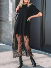 Black t-shirt maxi dress with floral lace hem and sheer lace paneling.