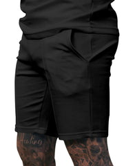 Black chino shorts with drawstring and side pockets, men's casual wear.