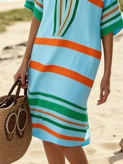 Striped midi dress in pastel blue with orange and green horizontal stripes, half sleeves.