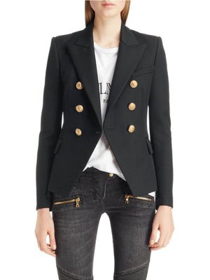 Black double-breasted blazer with gold buttons and a collar, styled with a white tee and jeans.