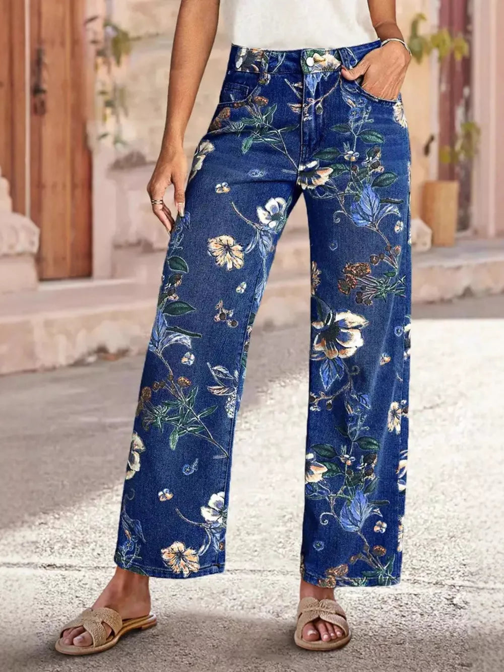Dark blue denim wide-leg jeans with all-over floral embellishments.