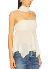 White asymmetrical sheer top with elegant scarf detail and ruched bodice.