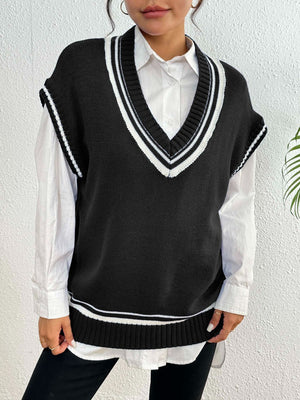 Black acrylic knit vest with contrast white trim and V-neck