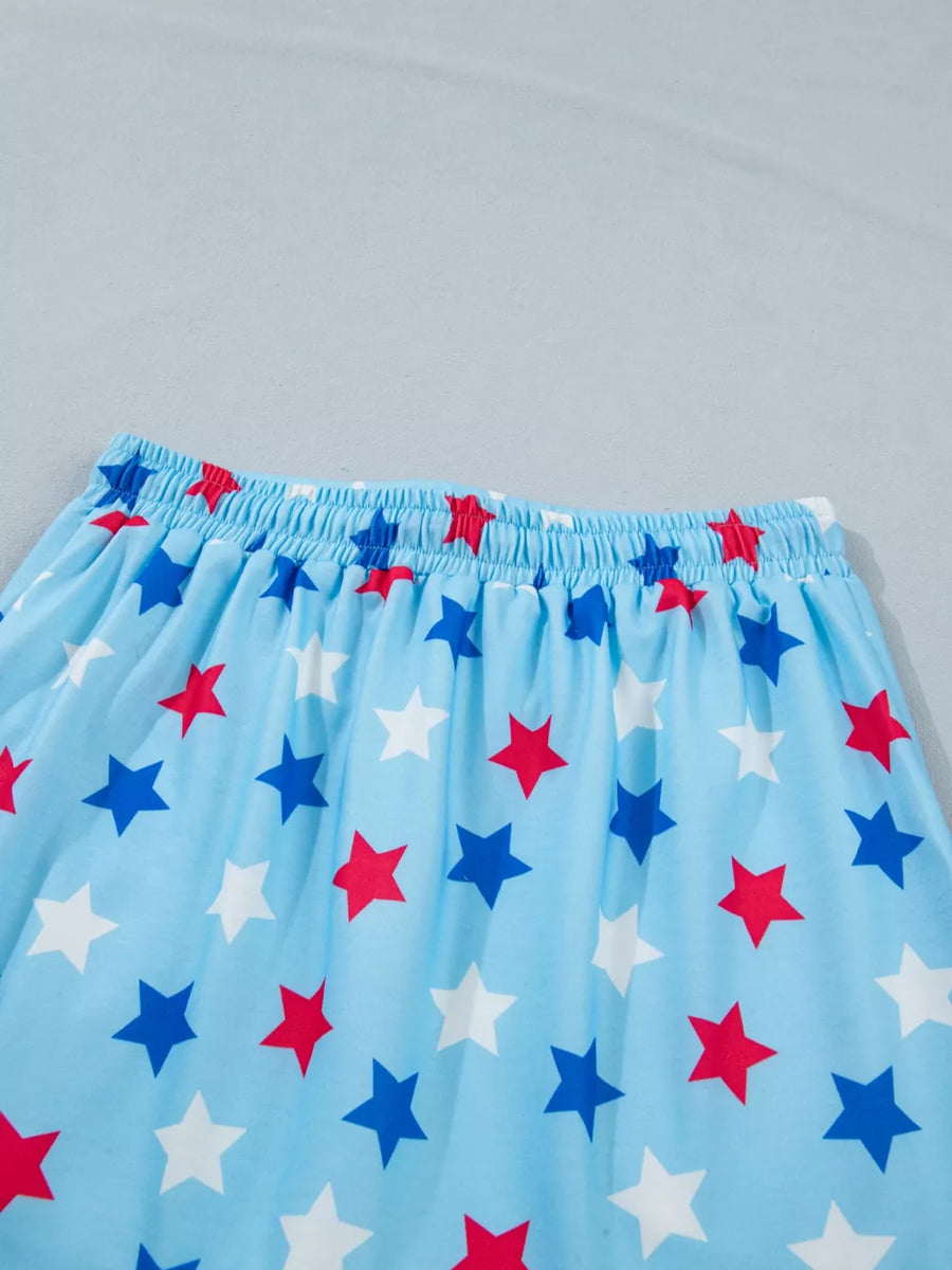 Light blue skort with red, white, and blue star print and elastic drawstring waist.