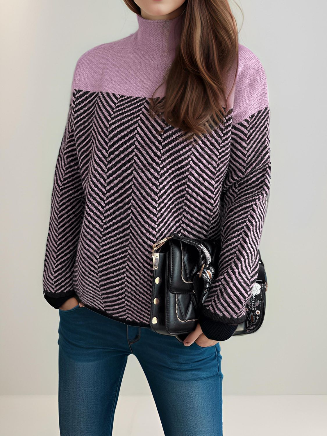 Chevron knit turtleneck sweater in lavender and black with a chevron pattern.