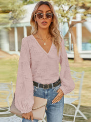 Textured puff sleeve v-neck blouse in blush pink with balloon sleeves.