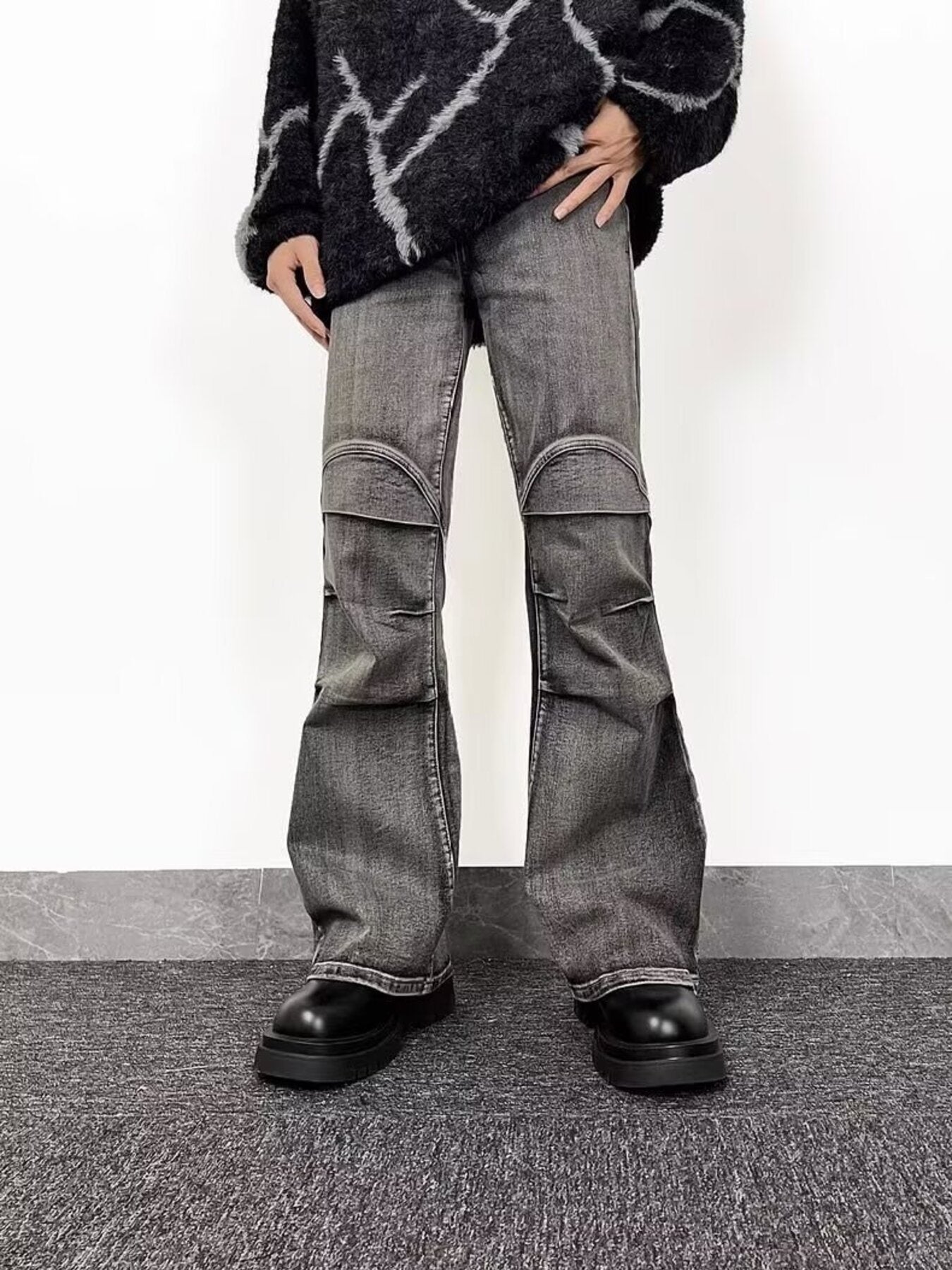 Men's relaxed fit washed flare jeans in grey denim with distressed knee details.