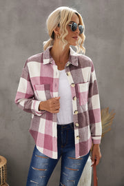 Oversized checkered shacket in pink and white with button-down front and patch pockets.