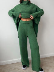 Oversized green acrylic turtleneck lounge set with wide leg pants.