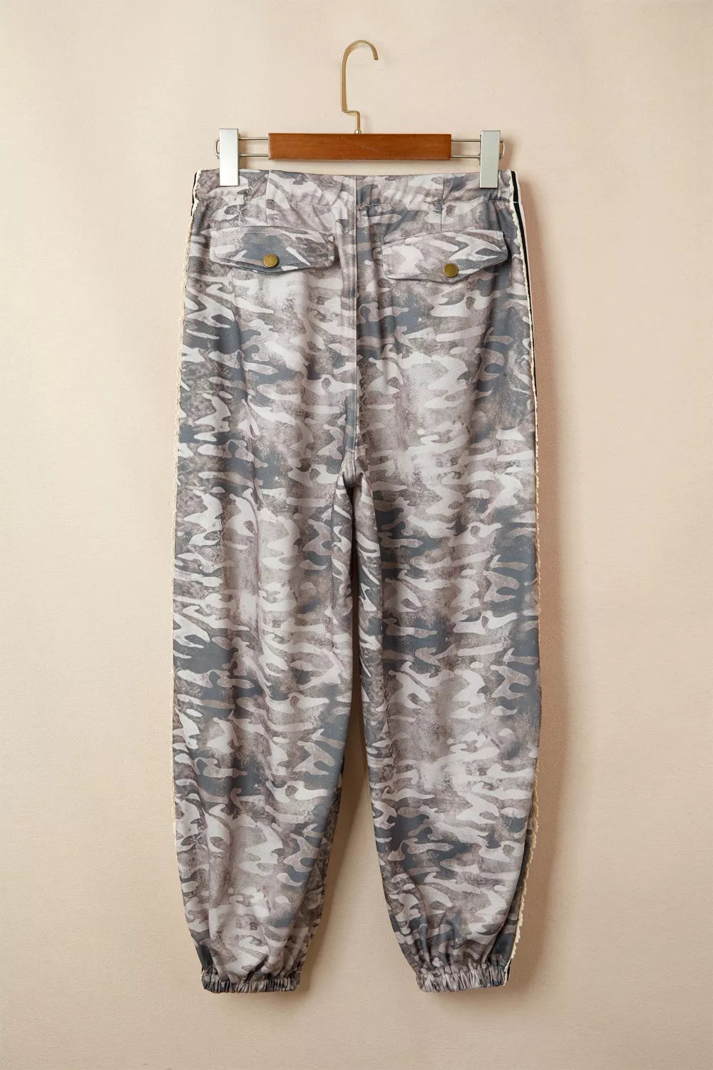 Camo print relaxed fit maternity pants in grey with drawstring and button flap back pockets.