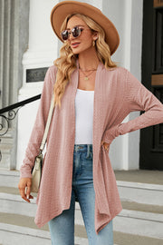 Dusty Pink textured knit cardigan with asymmetrical hem and open front.