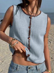 Light blue knit sweater vest with brown trim and buttons, sleeveless, crew neck.