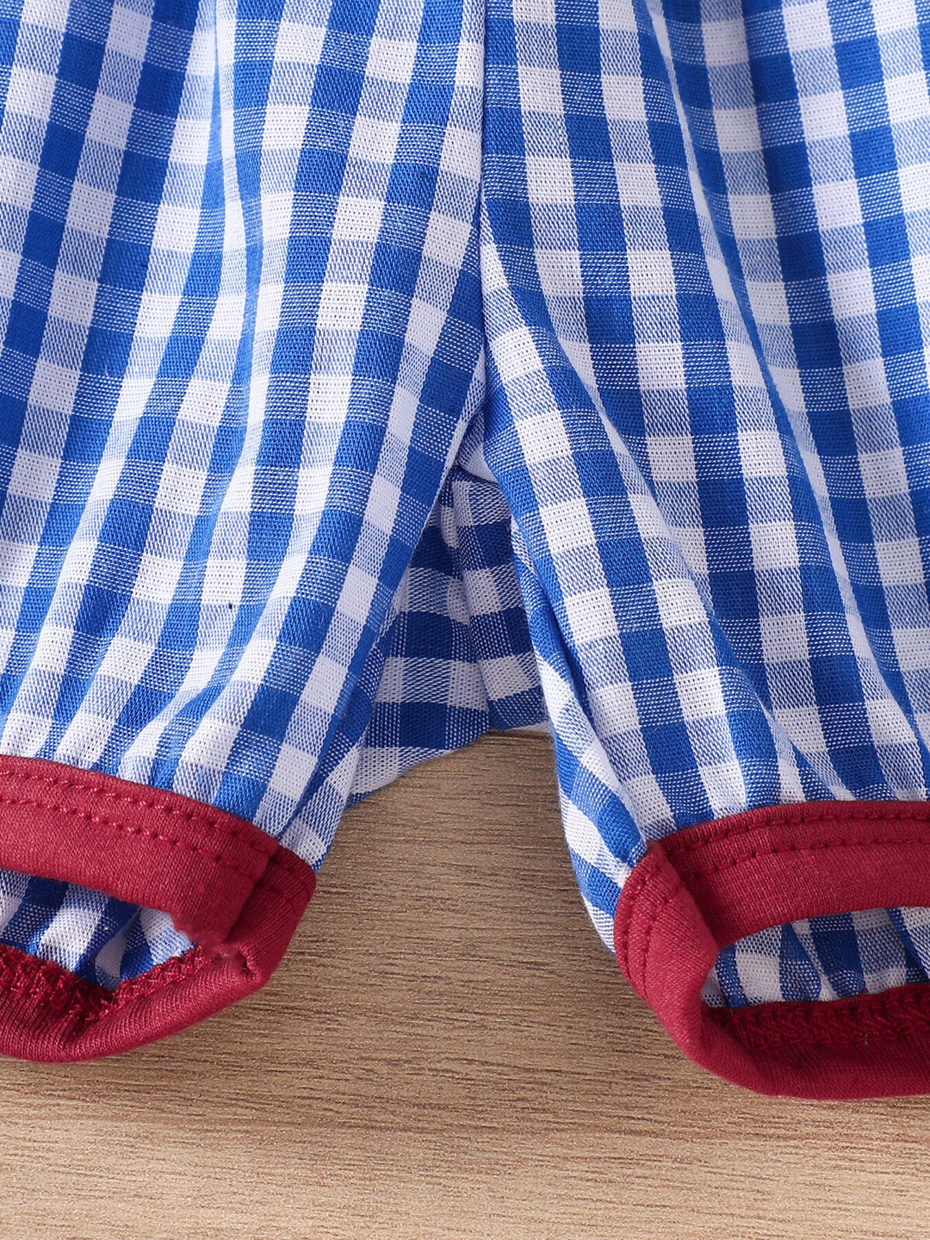 Baby set with blue and white gingham pattern and red trim detail
