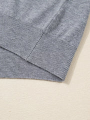 Gray ribbed V-neck sweater with ribbed hem detail