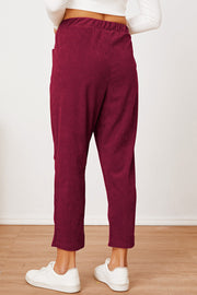 Corduroy barrel-leg utility pants in Scarlet with elastic waist and pockets.