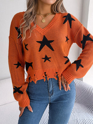 Orange star print v-neck knit sweater with distressed hem