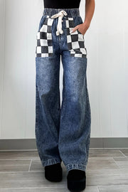 Checkerboard pocket wide-leg jeans in medium acid wash denim with drawstring waist.