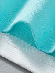 Toddler t-shirt detail showing turquoise cotton fabric with white stitching and hem.