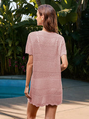 Blush pink crochet beach cover-up dress with short sleeves and open knit pattern.