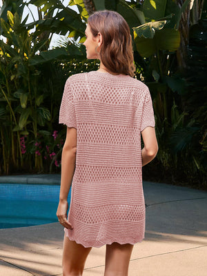 Blush pink crochet beach cover-up dress with short sleeves and open knit pattern.
