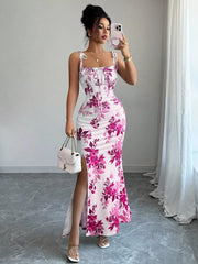 Floral print maxi dress with tie straps, ruched bodice, and high slit in pink and white.