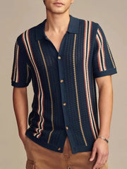 Textured knit polo shirt with vertical stripes in navy, beige, and rust.