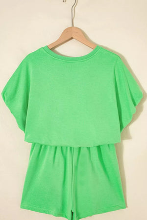 Green cotton two-piece outfit set with drawstring shorts and a layered top.