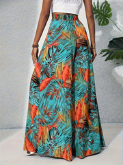Tropical print wide leg pants with elastic waistband and flowy silhouette.