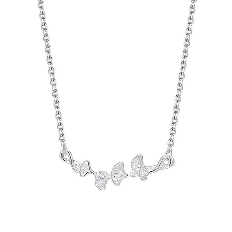 Silver necklace with a delicate ginkgo leaf branch design.