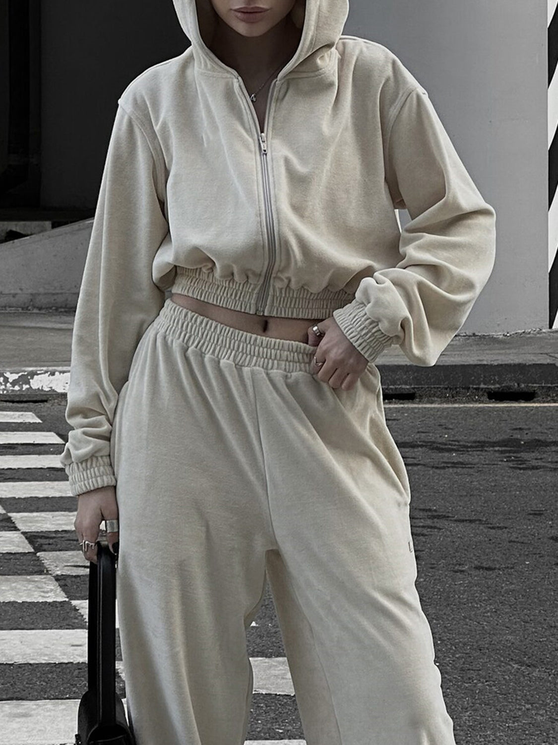 Apricot cropped zip hoodie and wide leg sweatpants set with elastic waistband and cuffs.