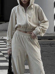 Apricot cropped zip hoodie and wide leg sweatpants set with elastic waistband and cuffs.