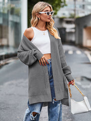 Open-stitch waffle knit duster cardigan in grey with open front and long sleeves.
