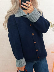 Navy button-down cardigan with textured grey collar and cuffs.