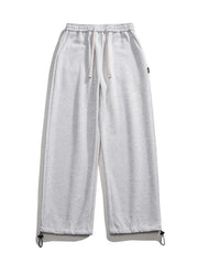 Light gray cotton sweatpants with drawstring waist and adjustable ankle cuffs.