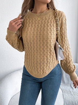Camel acrylic cable knit sweater with asymmetric hem and crew neck.