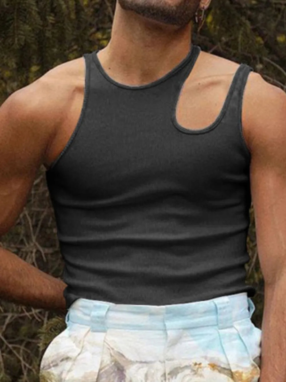 Black ribbed tank top with asymmetrical neckline and sculpted shoulder detail