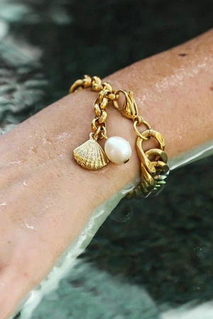 Gold chain bracelet with shell and pearl charms