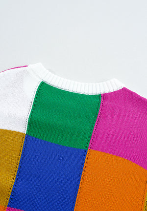 Patchwork knit crewneck pullover sweater in acrylic with color block pattern.