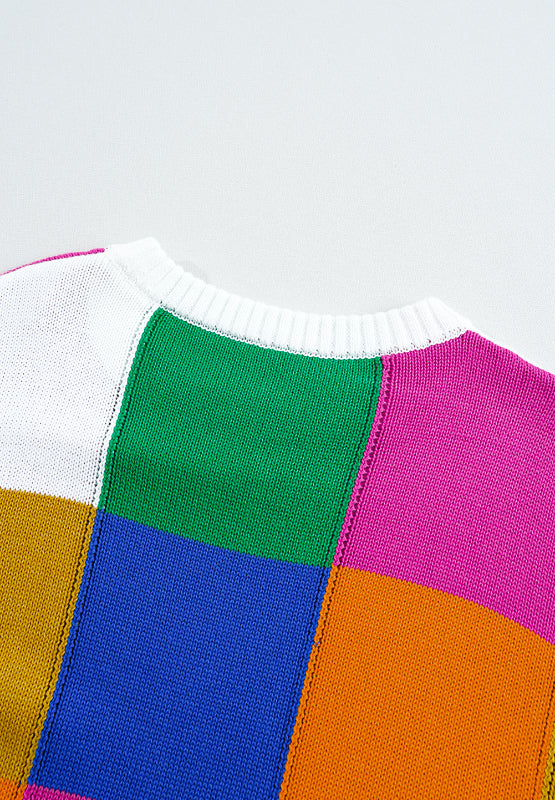 Patchwork knit crewneck pullover sweater in acrylic with color block pattern.