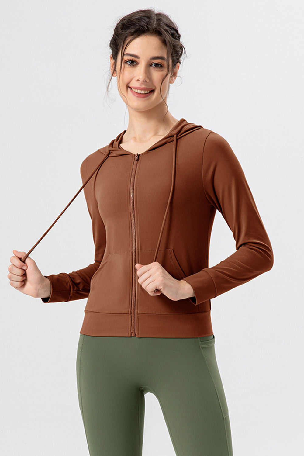 Brown zip-up hoodie with drawstrings and front pockets.