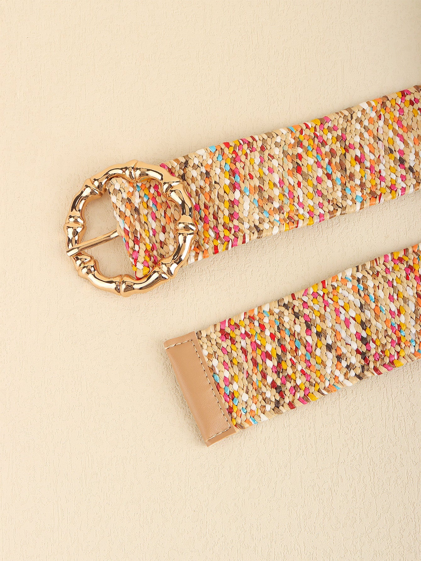 Woven raffia belt with multicolor flecks and a sculpted gold buckle.