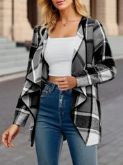 Asymmetric plaid drape front jacket in black and white, open front, long sleeves.