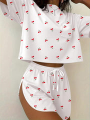 White cherry print pajama set with drawstring shorts and short sleeve top.