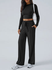 Black ribbed knit crop top and wide leg pants set with drawstring waist.