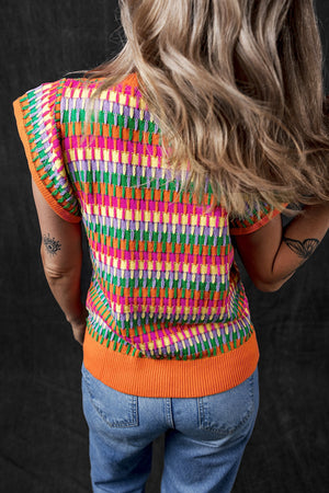 Geometric knit flutter sleeve top with colorful pattern and orange trim.