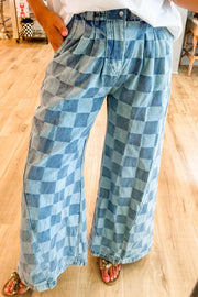Checkerboard denim wide leg trousers in dusty blue with pleats and a relaxed fit.